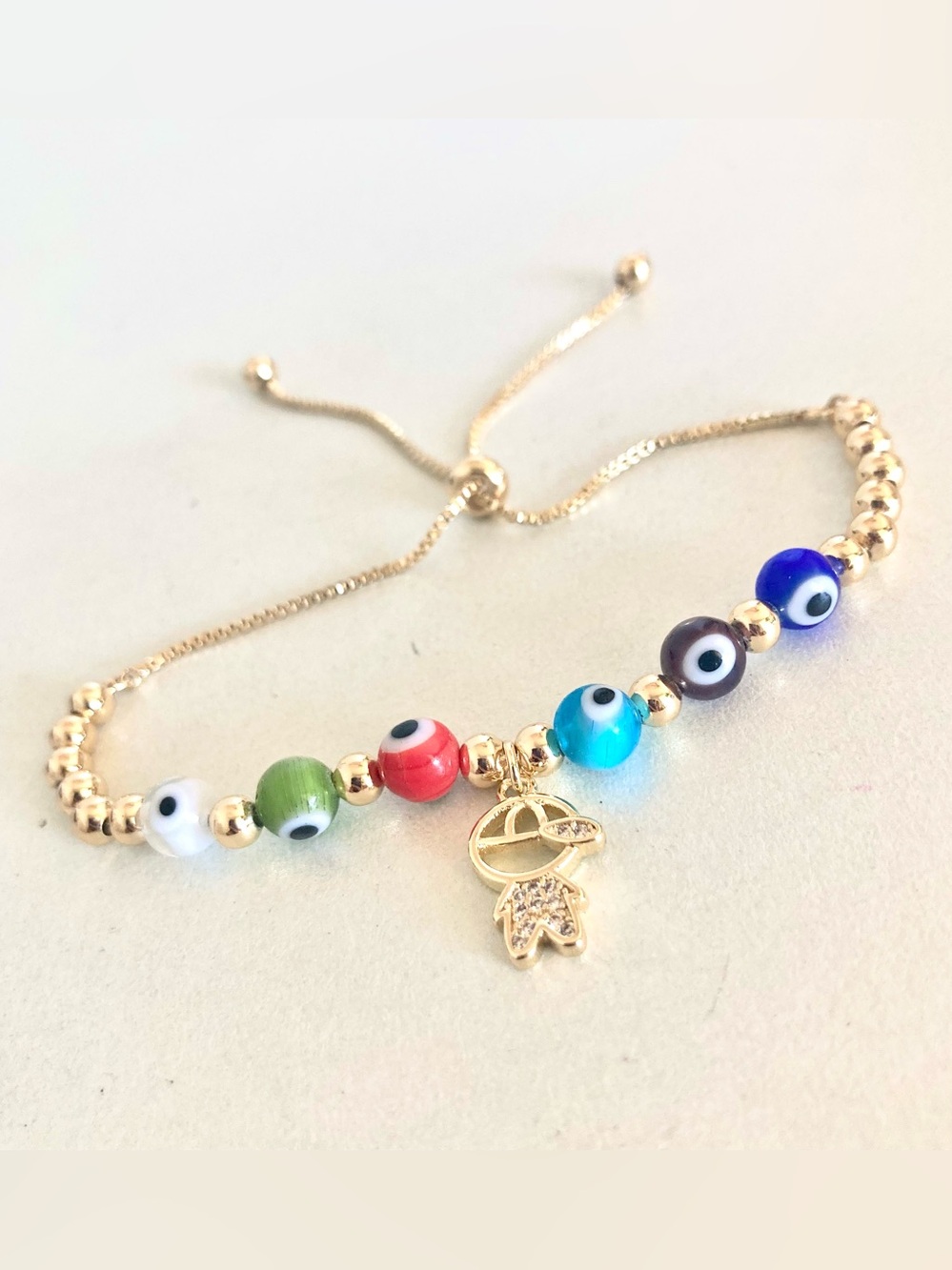 NWOT Adjustable Gold tone Beaded Bracelet with Multicolor Evil Eye Beads